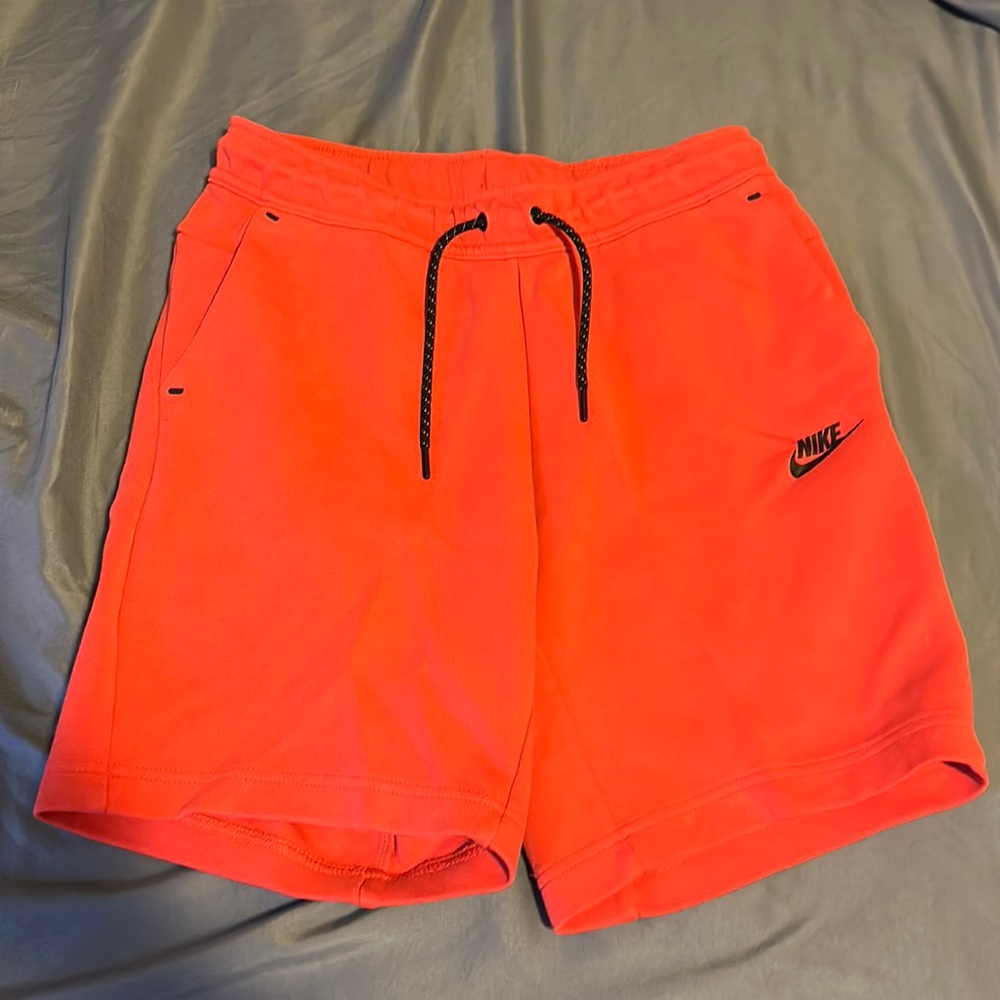 Red Nike tech shorts